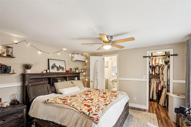 4580 NW 3rd Ave, Oakland Park, FL 33309 - bedroom with a closet, ensuite bath, a wall mounted AC, wood finished floors, and a walk in closet
