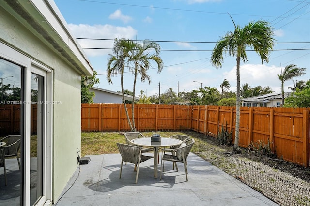 4580 NW 3rd Ave, Oakland Park, FL 33309 - view of patio / terrace with outdoor dining space and a fenced backyard