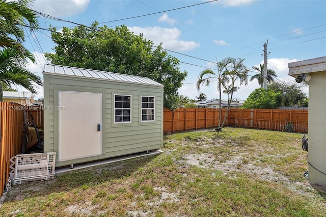 4580 NW 3rd Ave, Oakland Park, FL 33309 - view of yard with a fenced backyard, an outdoor structure, and a shed
