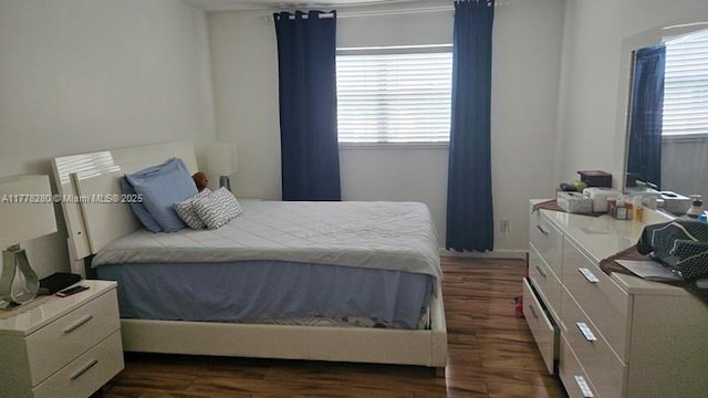 8595 Sunrise Lakes Blvd Unit 305, Sunrise, FL 33322 - bedroom featuring dark wood-style floors and baseboards