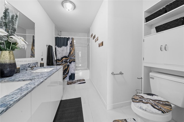 bathroom featuring a sink, shower / bath combo with shower curtain, toilet, double vanity, and tile patterned flooring
