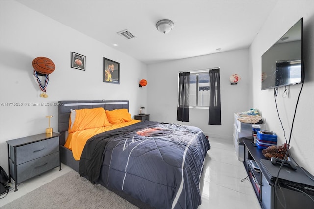 bedroom featuring tile patterned floors and visible vents