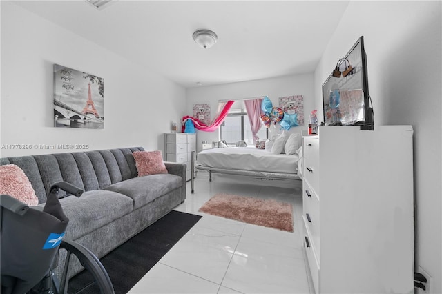 bedroom featuring marble finish floor