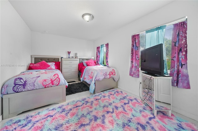 tiled bedroom with baseboards