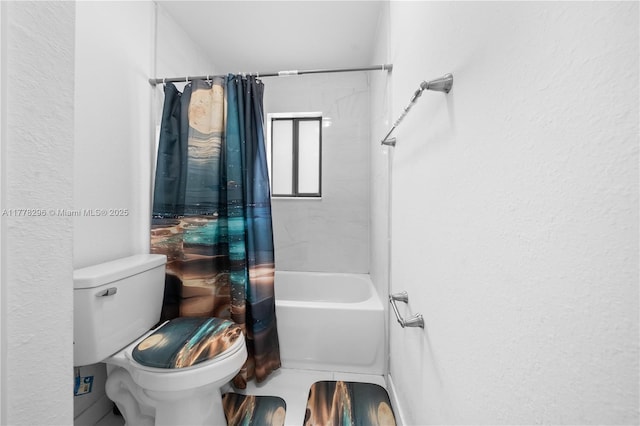 bathroom with a textured wall, toilet, and shower / bath combination with curtain