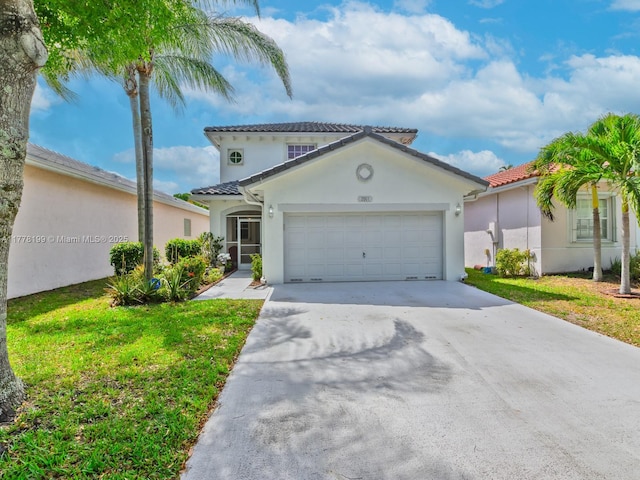 mediterranean / spanish-style home featuring a tiled roof, a garage, concrete driveway, a front lawn, and stucco siding