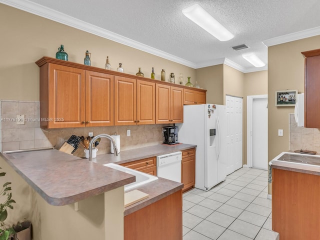 kitchen with visible vents, a peninsula, white appliances, ornamental molding, and light tile patterned floors