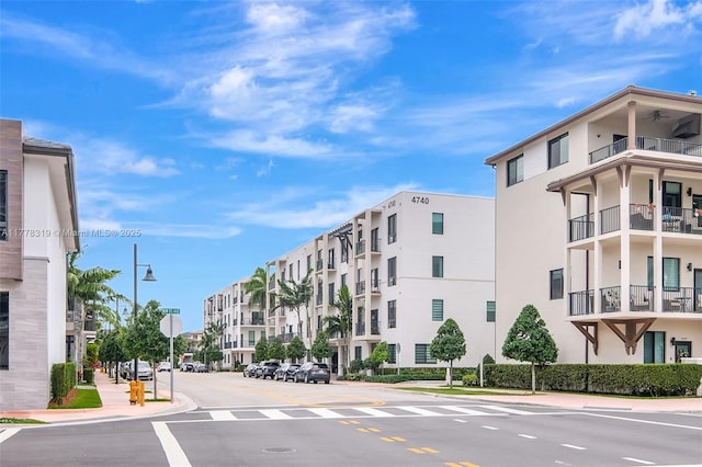 4740 NW 84th Ct Unit 32, Doral, FL 33166 - view of street featuring sidewalks, street lighting, traffic signs, and curbs