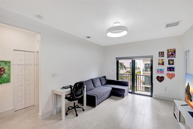 4740 NW 84th Ct Unit 32, Doral, FL 33166 - office area with baseboards, light wood-style flooring, and visible vents