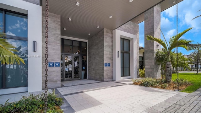 4740 NW 84th Ct Unit 32, Doral, FL 33166 - entrance to property with stone siding and french doors