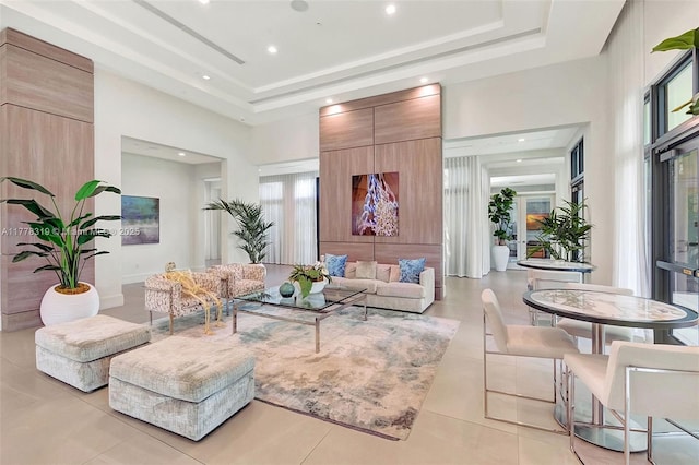 4740 NW 84th Ct Unit 32, Doral, FL 33166 - living room featuring a high ceiling, a raised ceiling, light tile patterned floors, and recessed lighting