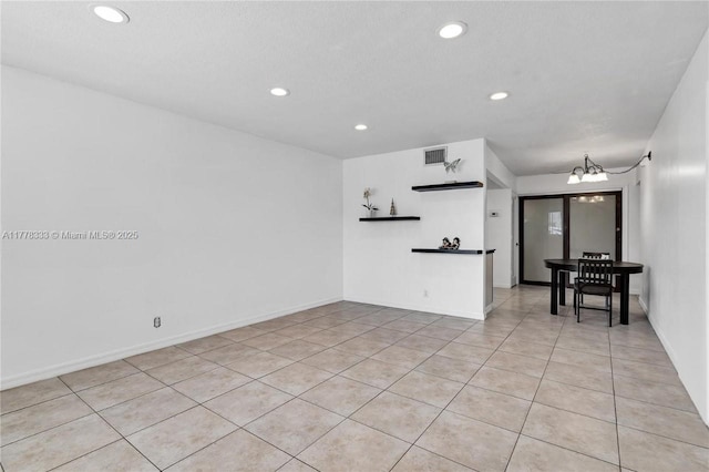 unfurnished living room featuring visible vents, recessed lighting, and light tile patterned flooring