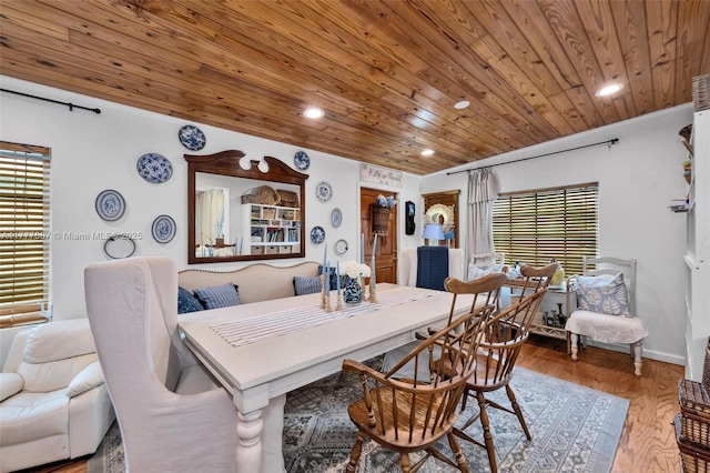dining room featuring recessed lighting, wooden ceiling, plenty of natural light, and wood finished floors