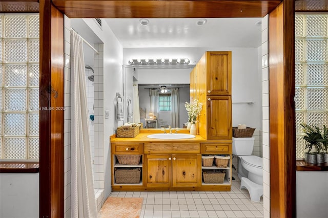 bathroom with toilet, a shower with curtain, tile patterned flooring, and vanity