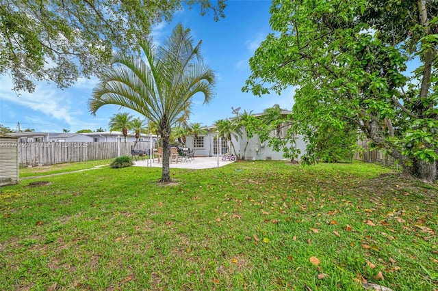 view of yard with a patio area and a fenced backyard
