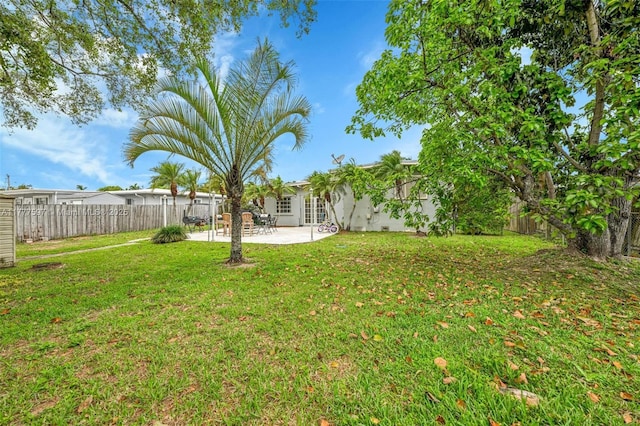view of yard with a fenced backyard and a patio
