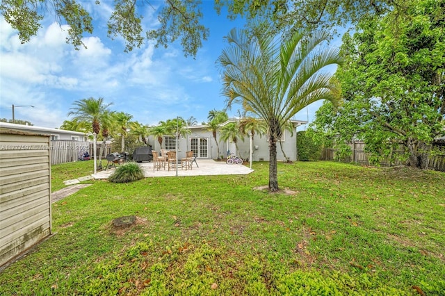 view of yard with a patio and a fenced backyard