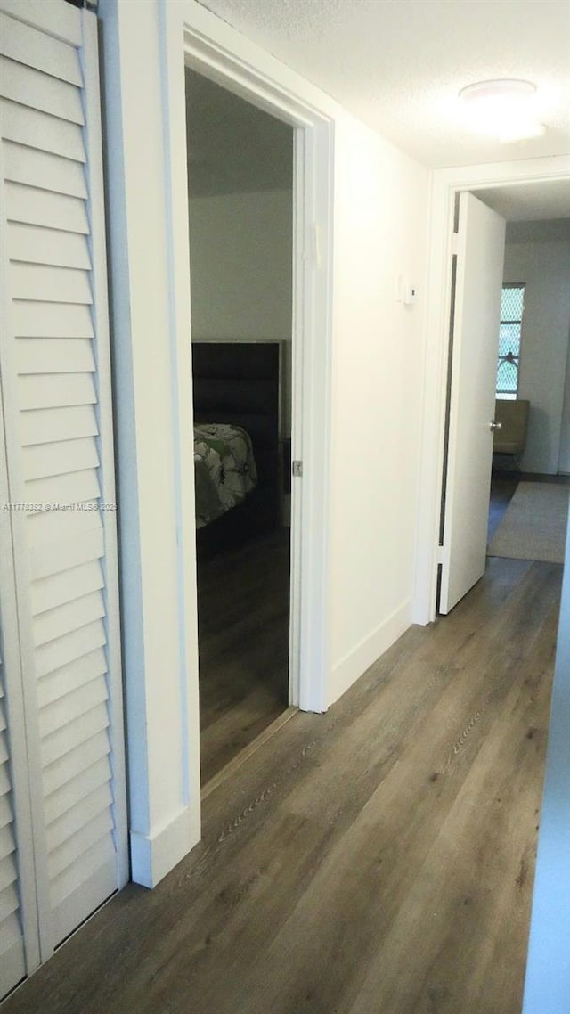 5054 Lakefront Blvd Unit A, Delray Beach, FL 33484 - hallway featuring wood finished floors and baseboards