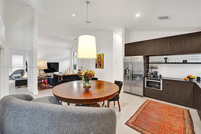 living room featuring recessed lighting and lofted ceiling