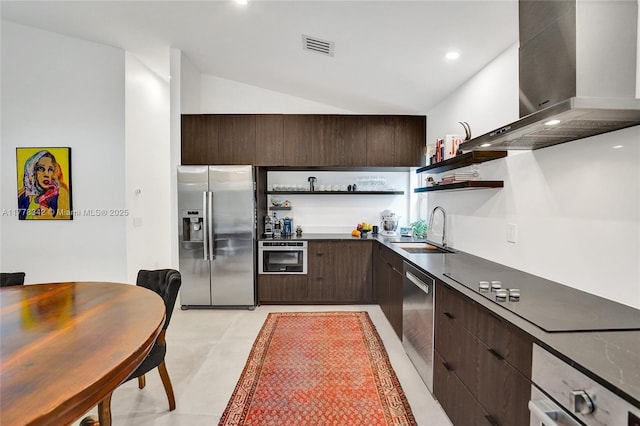 kitchen with open shelves, dark brown cabinets, wall chimney exhaust hood, a sink, and appliances with stainless steel finishes