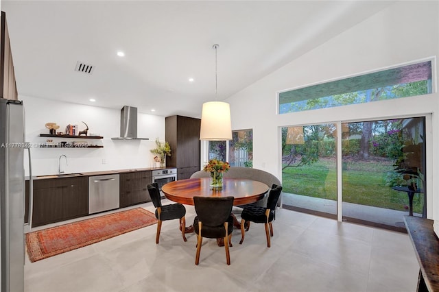 dining room featuring recessed lighting, high vaulted ceiling, and visible vents