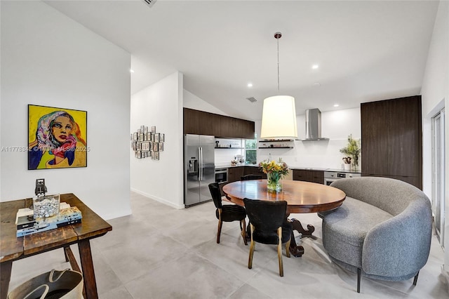 dining space featuring visible vents, concrete flooring, baseboards, recessed lighting, and vaulted ceiling