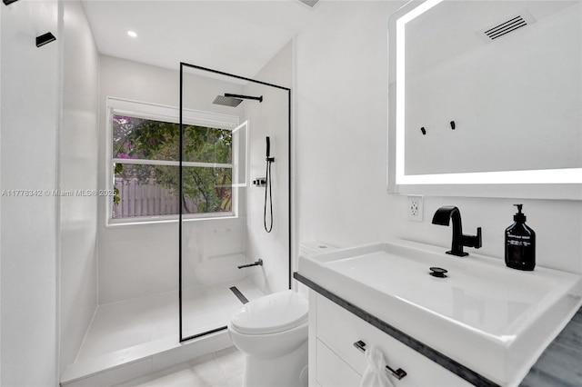 bathroom featuring visible vents, a walk in shower, and toilet