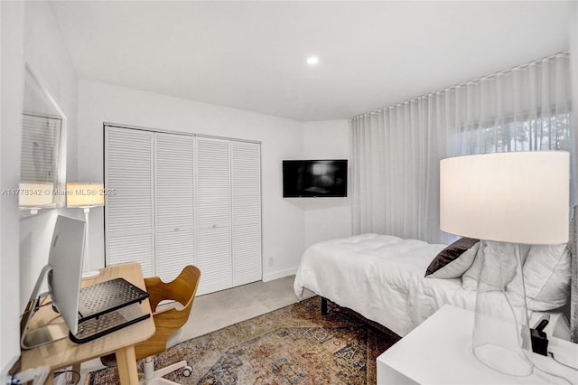 bedroom with a closet and recessed lighting
