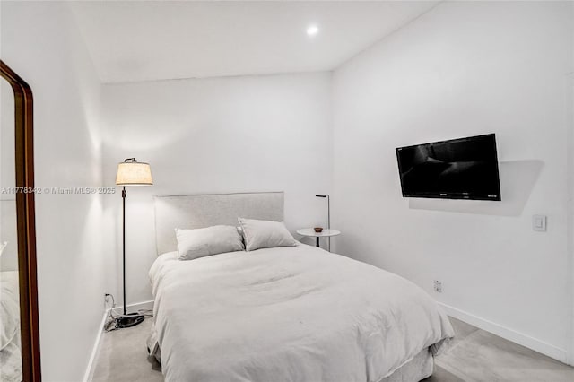 bedroom featuring baseboards