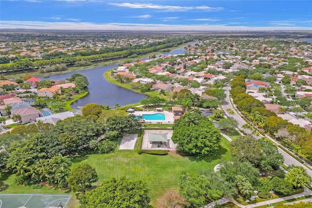 birds eye view of property featuring a water view and a residential view