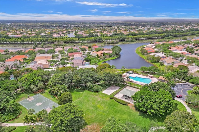 drone / aerial view with a residential view and a water view