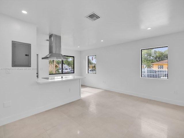 unfurnished living room featuring electric panel, recessed lighting, visible vents, and baseboards