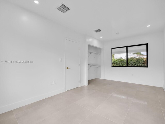 unfurnished bedroom featuring recessed lighting, visible vents, and baseboards
