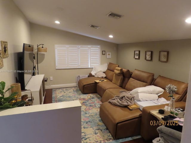 living area with recessed lighting, baseboards, lofted ceiling, and visible vents