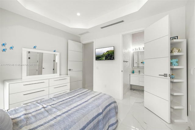 5815 SW 107th Pl, Miami, FL 33173 - bedroom with light marble finish flooring, recessed lighting, a tray ceiling, and connected bathroom