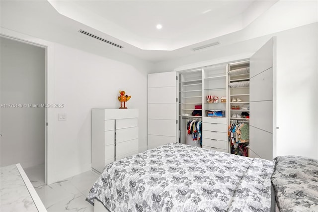 5815 SW 107th Pl, Miami, FL 33173 - bedroom featuring light marble finish floors, a closet, a tray ceiling, recessed lighting, and a spacious closet