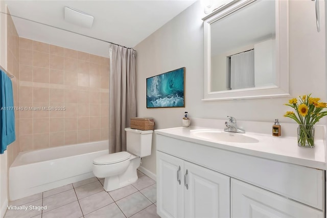 bathroom with tile patterned floors, toilet, vanity, and shower / bath combo