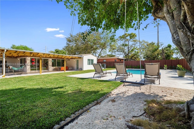 view of yard with a fenced backyard, a fenced in pool, and a patio