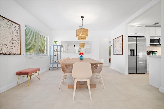 dining space with visible vents and baseboards