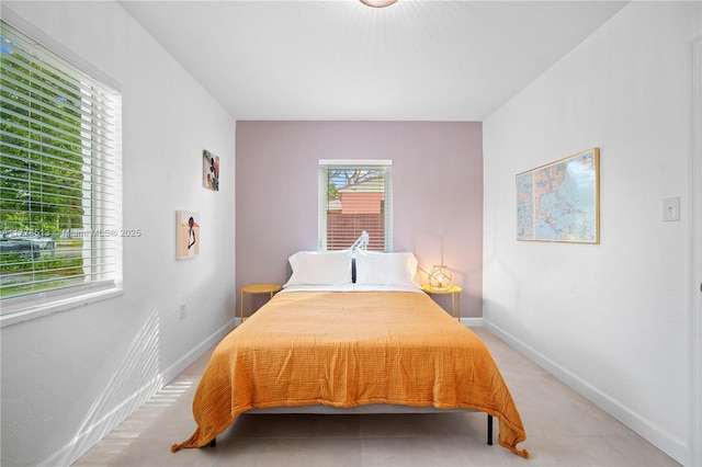 bedroom featuring baseboards