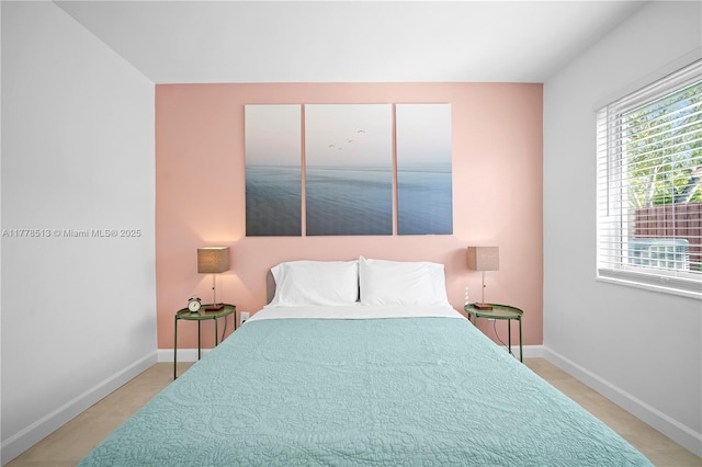 bedroom featuring baseboards