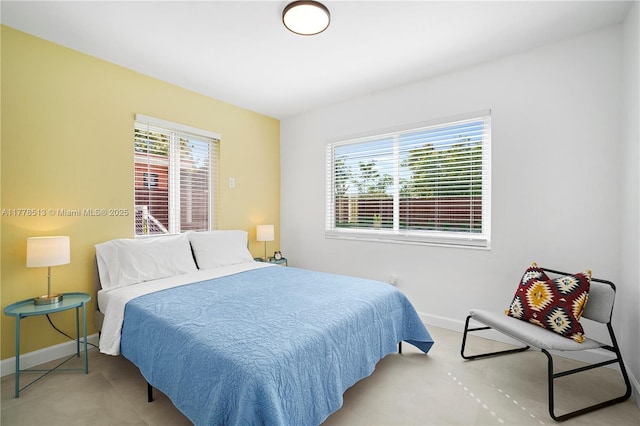 bedroom featuring baseboards