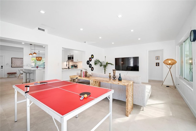 playroom featuring a sink, visible vents, and recessed lighting