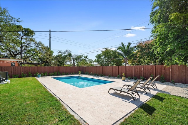view of pool featuring a fenced in pool, a yard, a patio area, and a fenced backyard