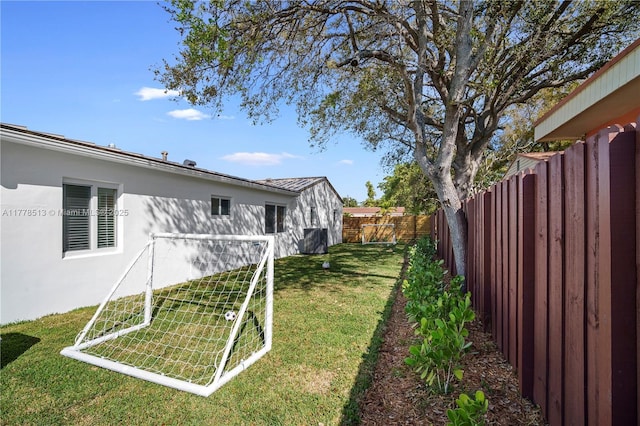 view of yard with a fenced backyard