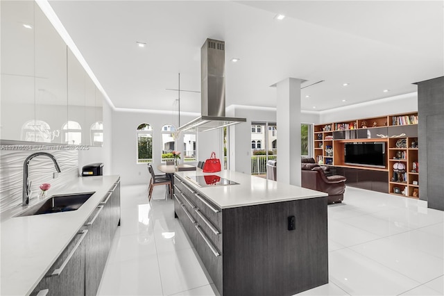 3106 NE 210th Ter, Aventura, FL 33180 - kitchen with a sink, modern cabinets, island range hood, light tile patterned flooring, and light countertops