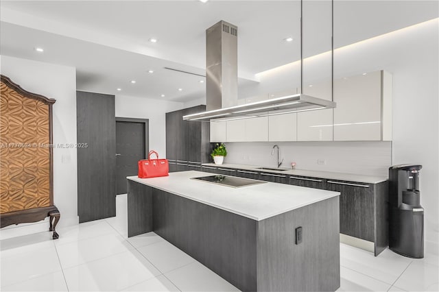 3106 NE 210th Ter, Aventura, FL 33180 - kitchen featuring modern cabinets, a sink, black electric stovetop, island exhaust hood, and a large island