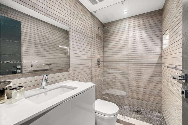 3106 NE 210th Ter, Aventura, FL 33180 - bathroom with a shower stall, toilet, vanity, and tile walls
