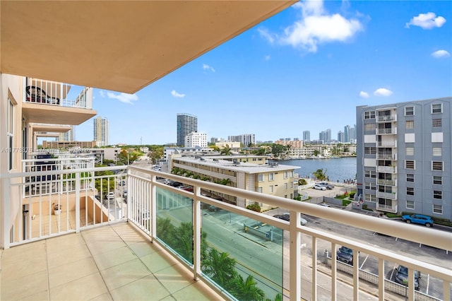 balcony with a view of city and a water view
