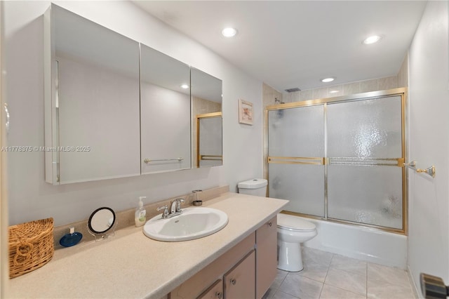bathroom featuring tile patterned floors, toilet, recessed lighting, and vanity